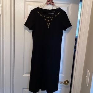 Women’s black dress with neck accents